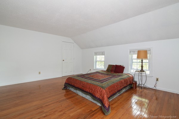37 Tenney Road Rowley, MA 01969 - Photo 15 of 20 a bedroom with a bed and window