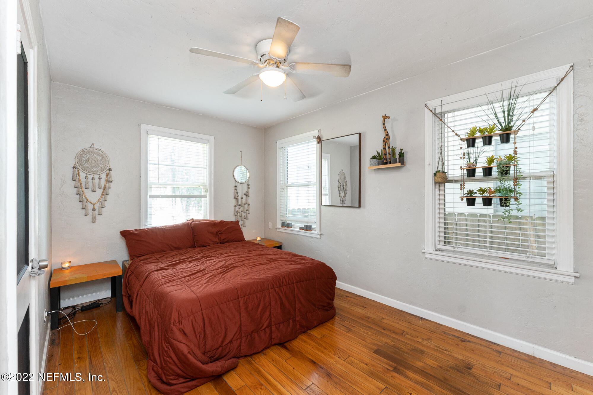 5015 Birkenhead Road Jacksonville, FL 32210 - Photo 11 of 17 a bedroom with a large bed and a window