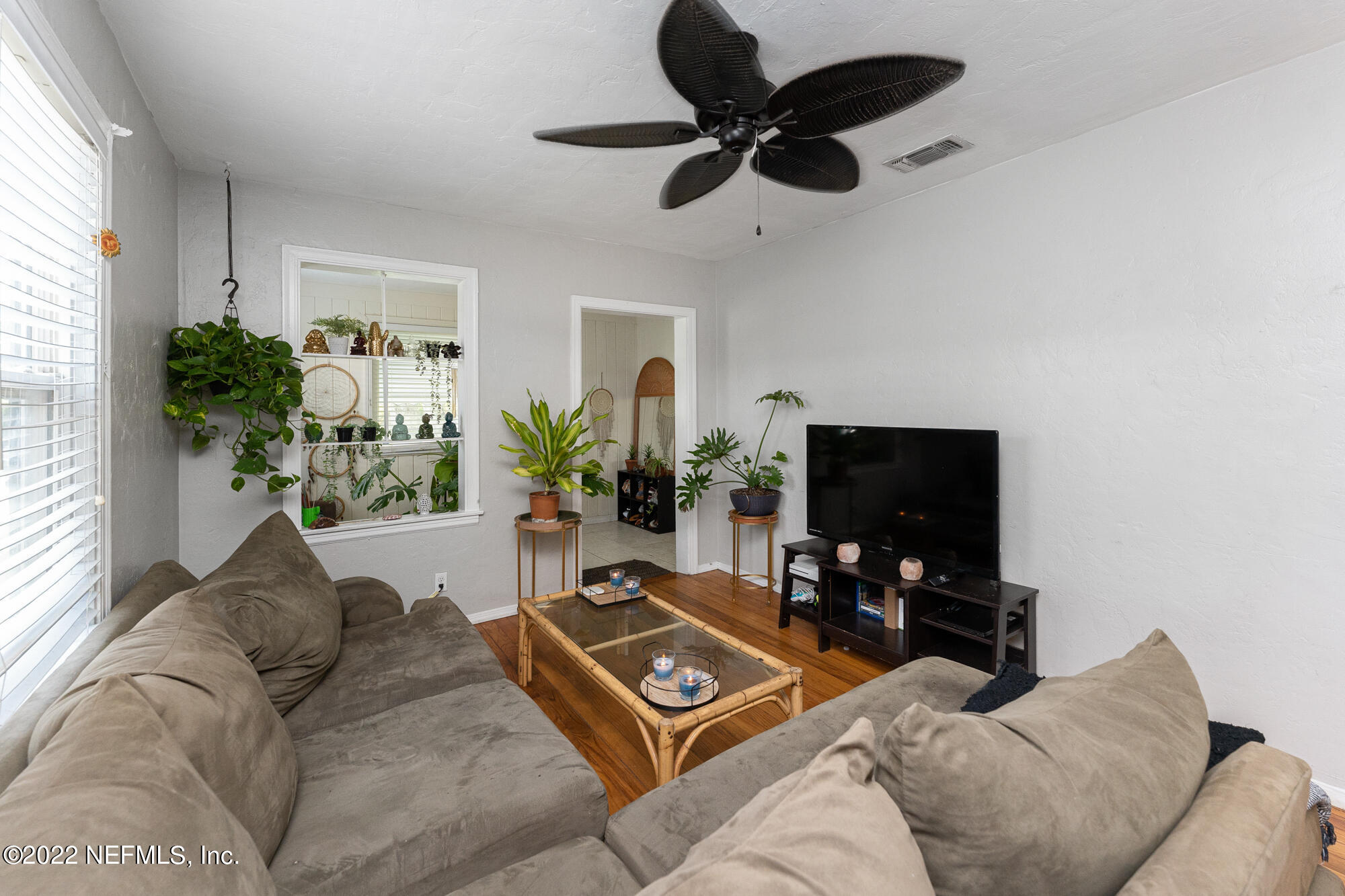 5015 Birkenhead Road Jacksonville, FL 32210 - Photo 4 of 17 a living room with furniture and a flat screen tv