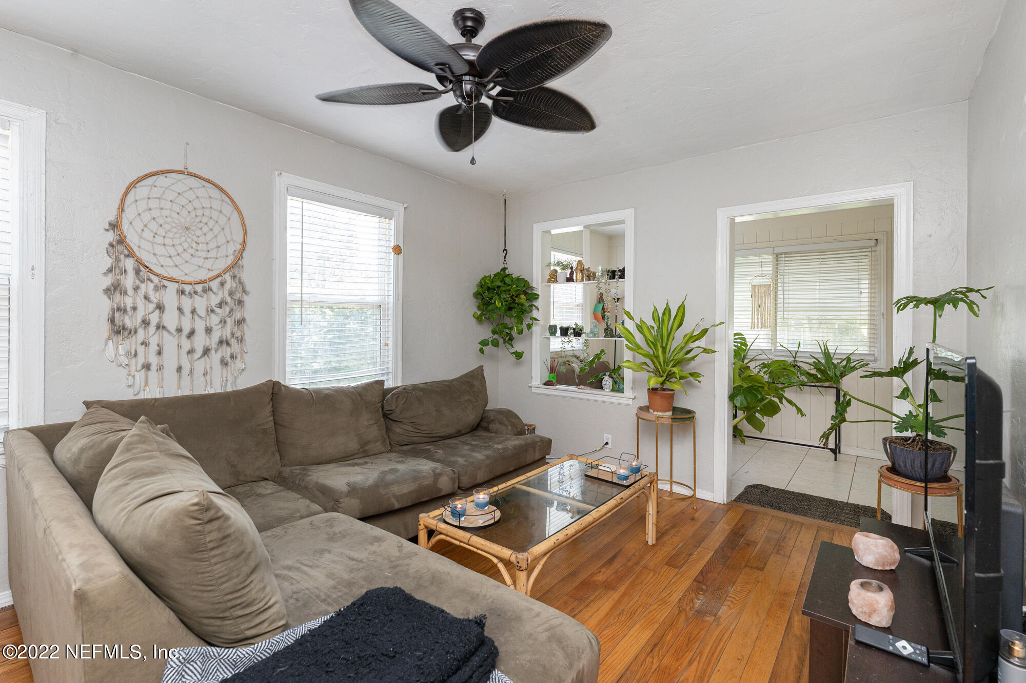 5015 Birkenhead Road Jacksonville, FL 32210 - Photo 5 of 17 a living room with furniture and a large window