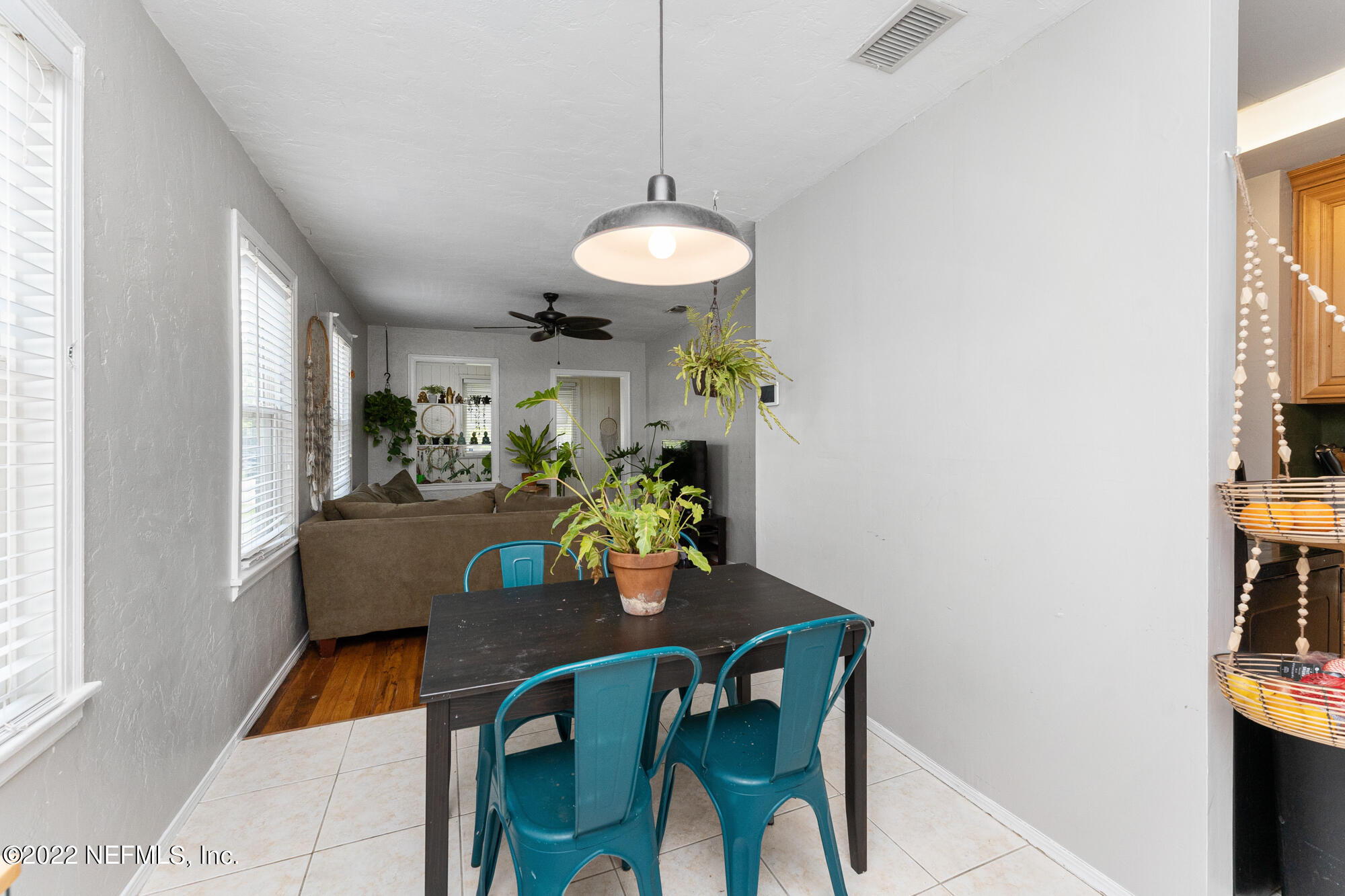 5015 Birkenhead Road Jacksonville, FL 32210 - Photo 7 of 17 a dining room with furniture and chandelier