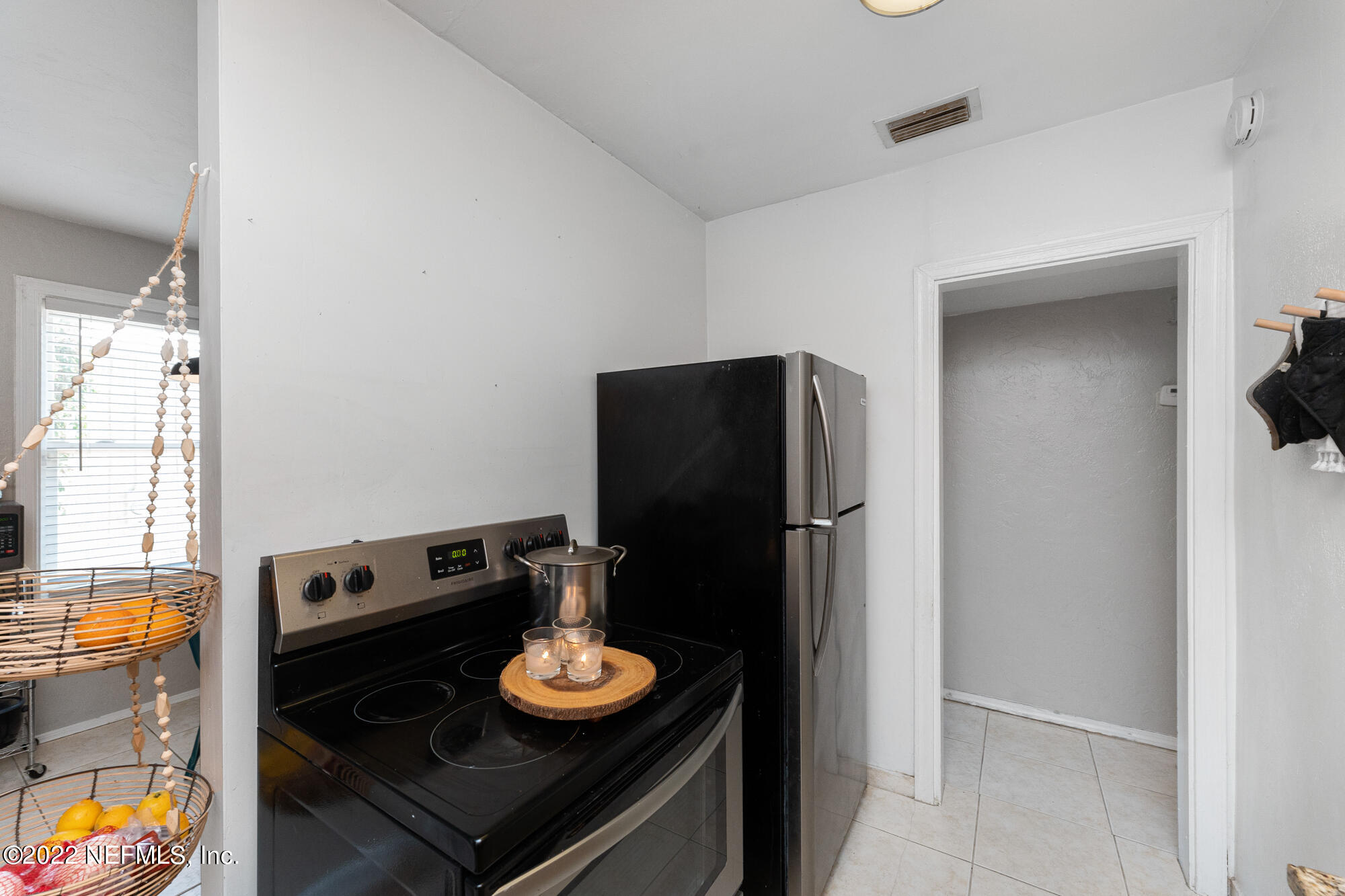 5015 Birkenhead Road Jacksonville, FL 32210 - Photo 9 of 17 a view of a dining table and chairs in the kitchen