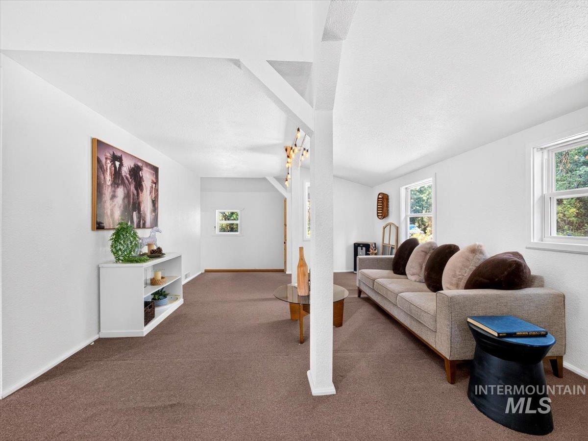 6 Rattlesnake Road Boise City, ID 83716 - Photo 16 of 50 Spacious room with white walls, textured ceilings, and brown carpeting