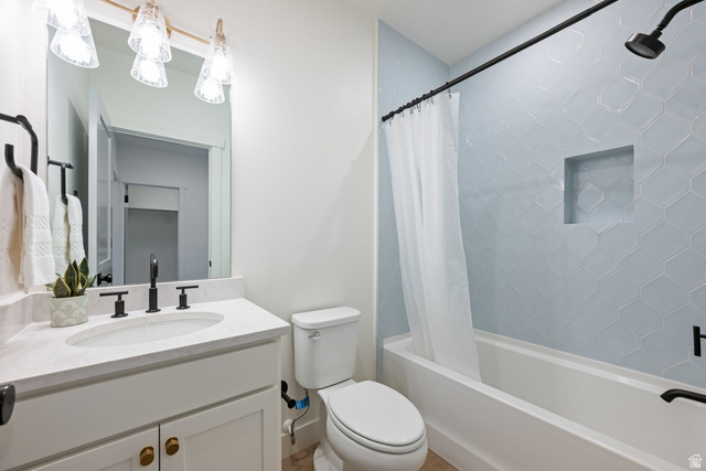 762 West Periwinkle Lane, Unit 102 St. George, UT 84790 - Photo 24 of 40 Bathroom featuring vanity and shower / bathtub combination with curtain