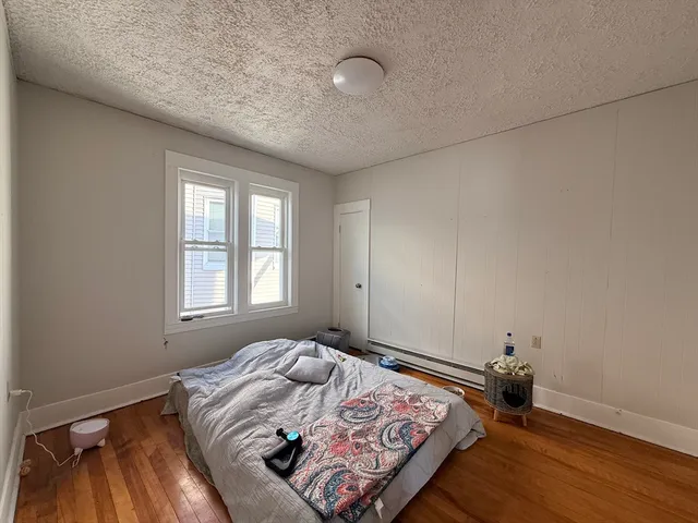 a bedroom with bed and window