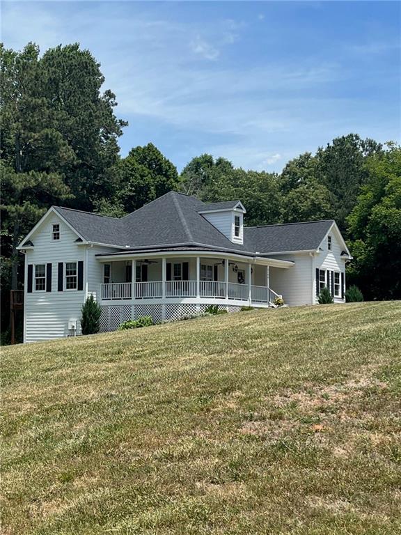 2196 Upper Burris Road Ball Ground, GA 30107 - Photo 1 of 1 a house view with a garden space