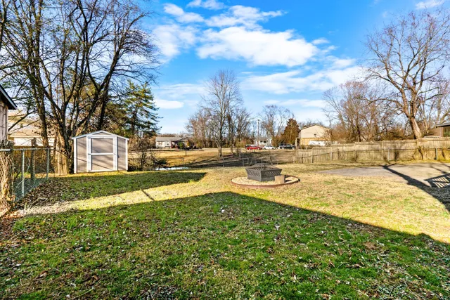 a view of a porch with wooden floor in front of house