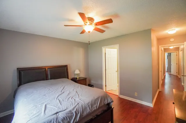 a bathroom with a toilet and a mirror