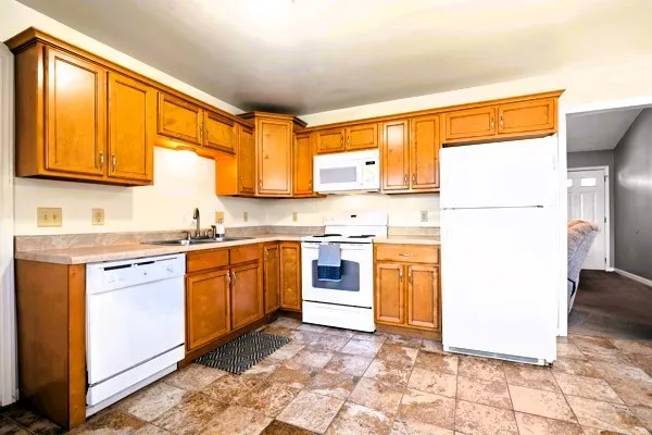 an aerial view of a house with a yard pool patio and outdoor seating