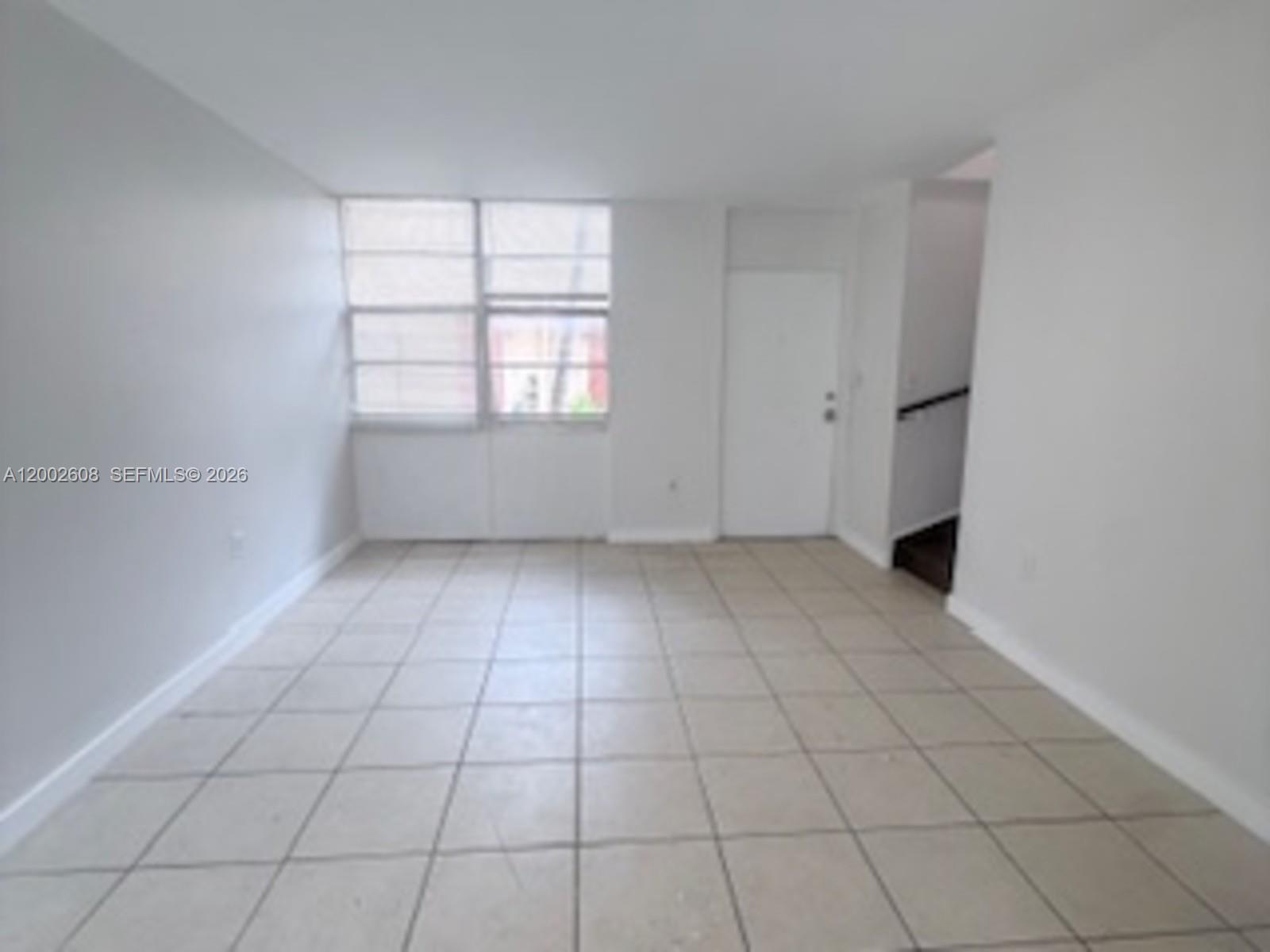 5966 Southwest 68th Street, Unit 109 Miami, FL 33143 - Photo 12 of 12 an empty room with windows
