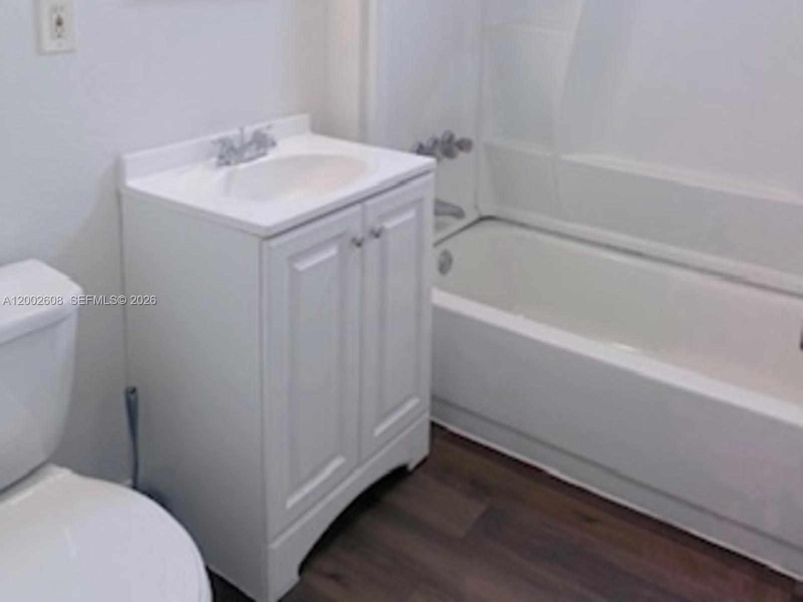 5966 Southwest 68th Street, Unit 109 Miami, FL 33143 - Photo 7 of 12 a bathroom with a sink and a toilet