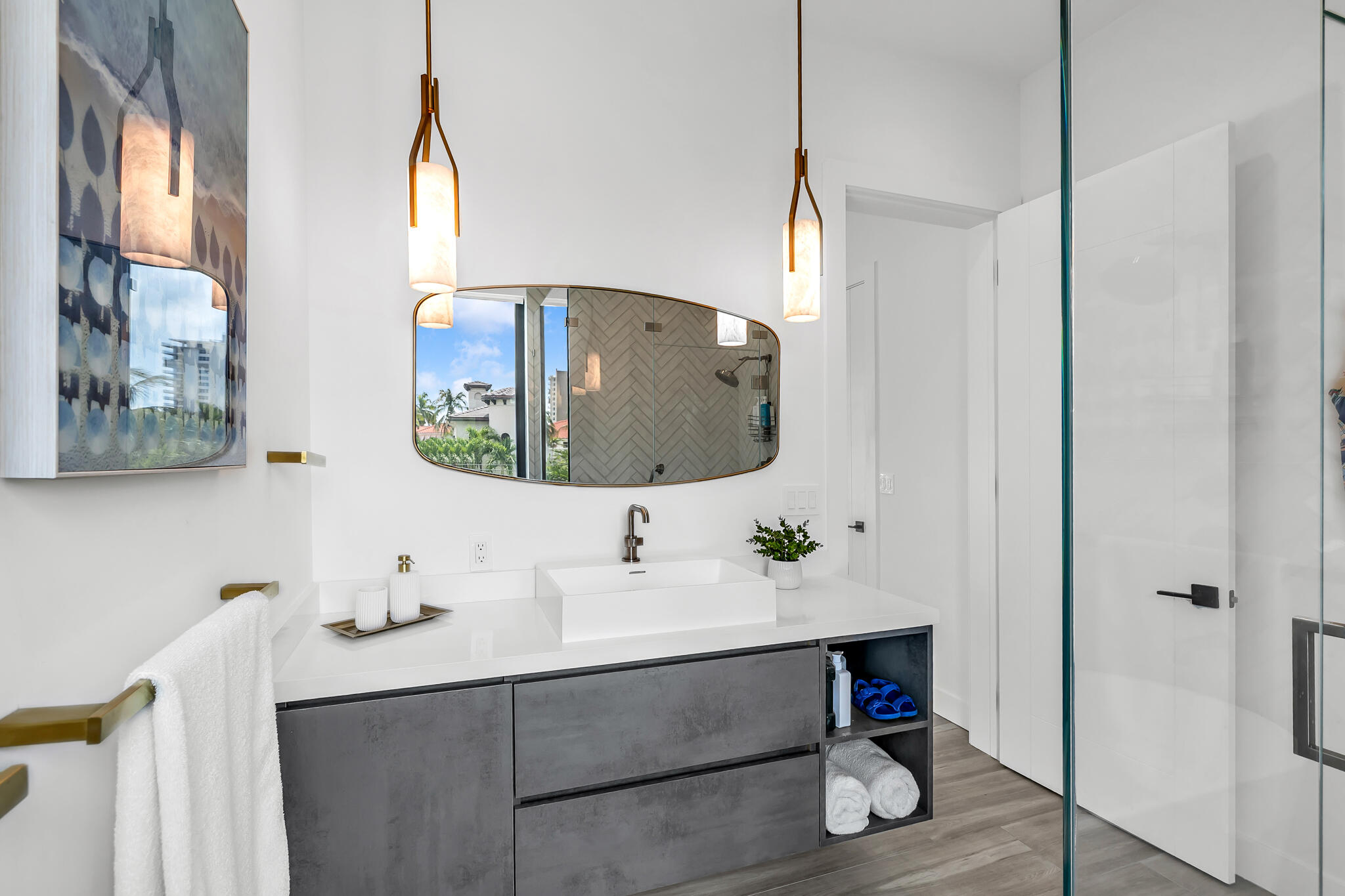 3711 Northeast 30th Avenue Lighthouse Point, FL 33064 - Photo 49 of 57 a bathroom with a sink and a mirror