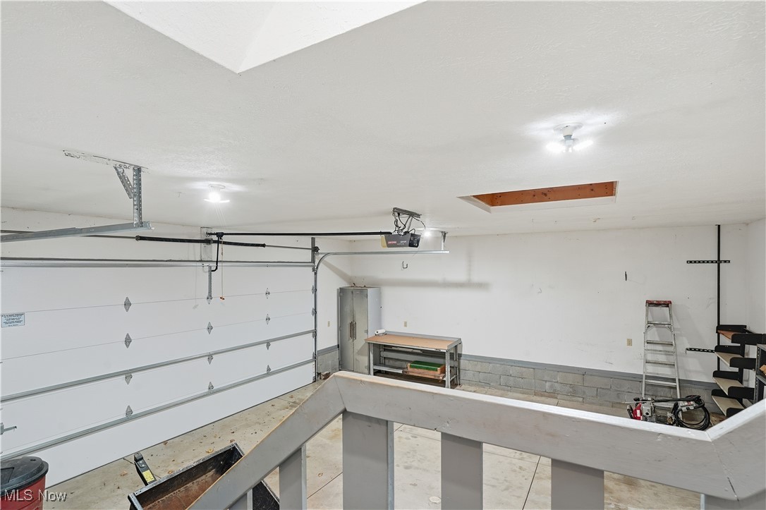 3275 Ranfield Road Kent, OH 44240 - Photo 32 of 33 Garage featuring a garage door opener