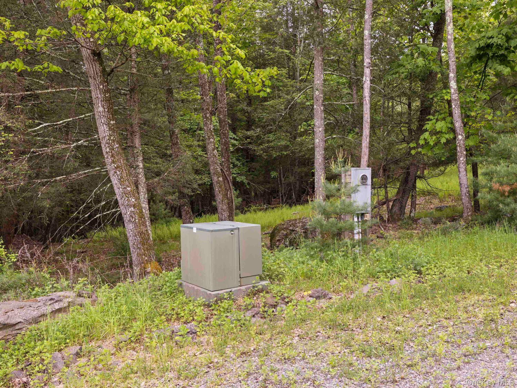 40 Mamoud Hills Road Kingston, NY 12401 - Photo 27 of 42 a backyard of a house with outdoor seating and trees