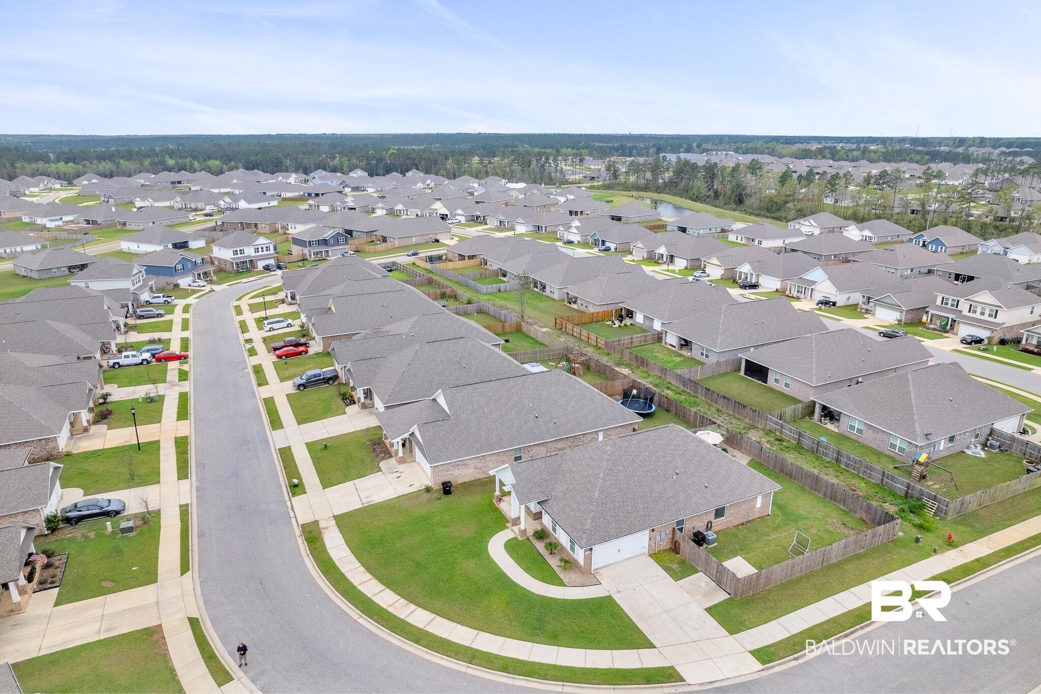 31650 Memphis Loop Daphne, AL 36527 - Photo 58 of 68 Aerial perspective of suburban area with a nearby body of water