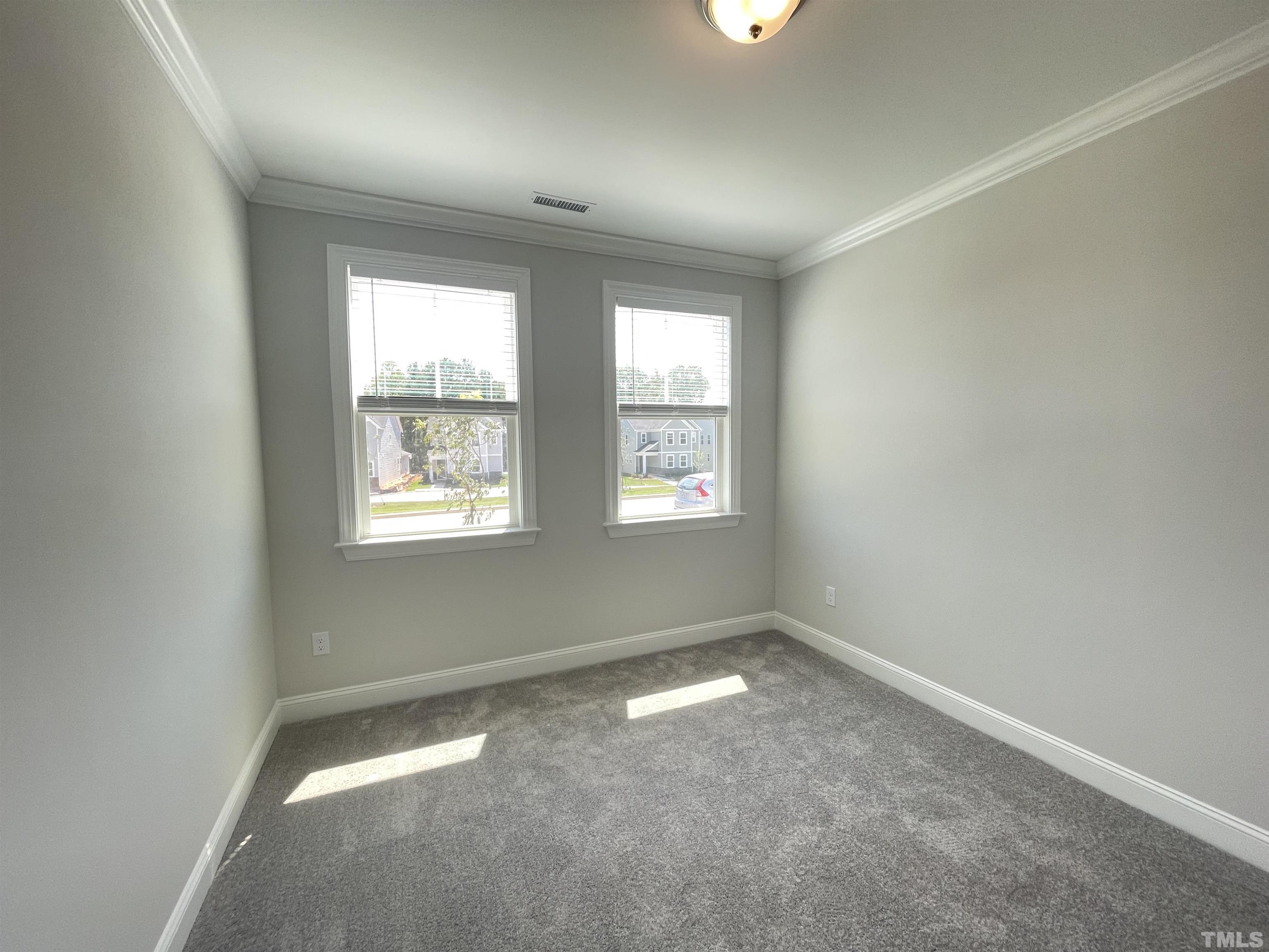 167 Edge Of Auburn Boulevard Clayton, NC 27520 - Photo 11 of 27 an empty room with windows