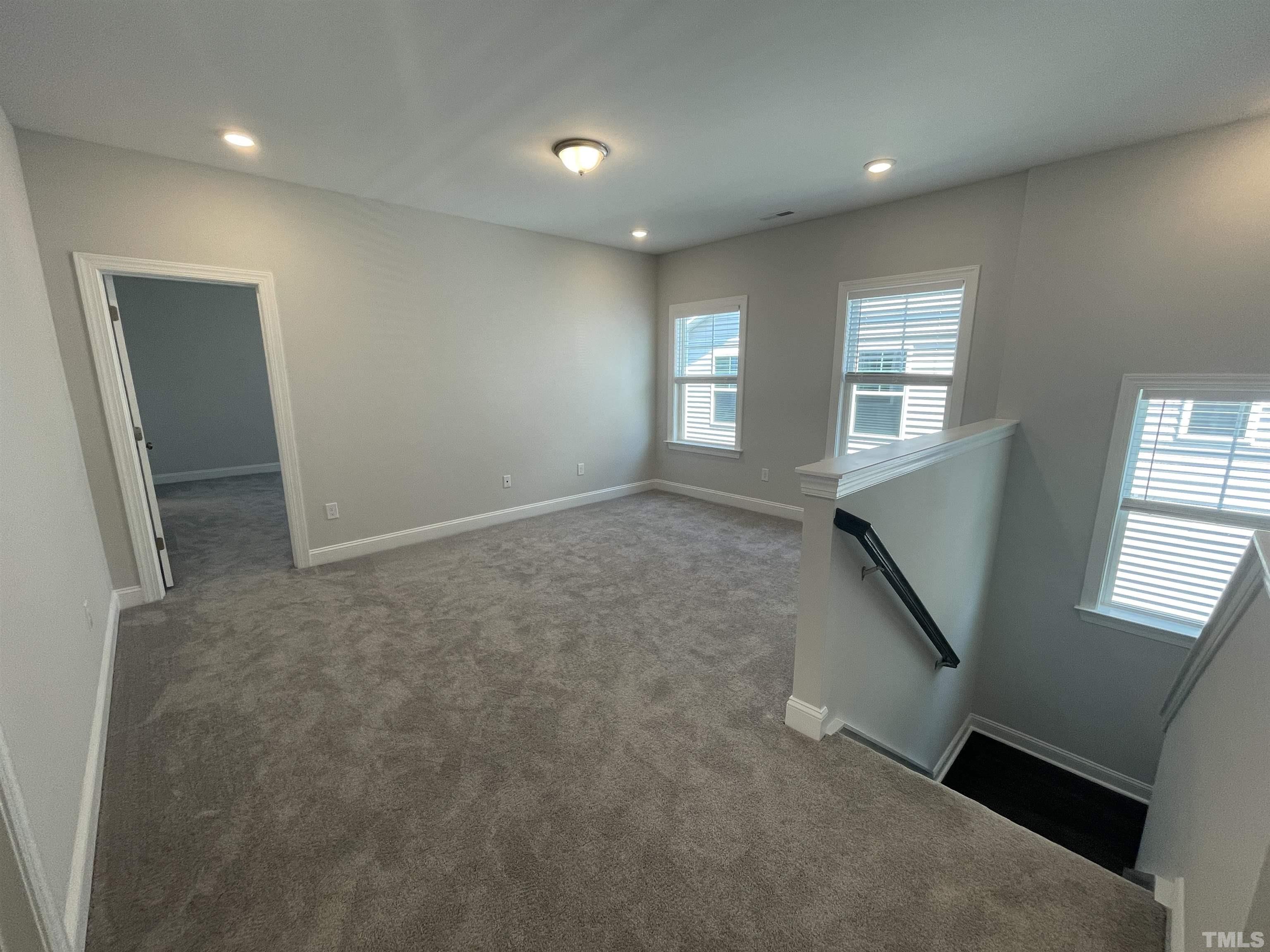 167 Edge Of Auburn Boulevard Clayton, NC 27520 - Photo 13 of 27 an empty room with windows