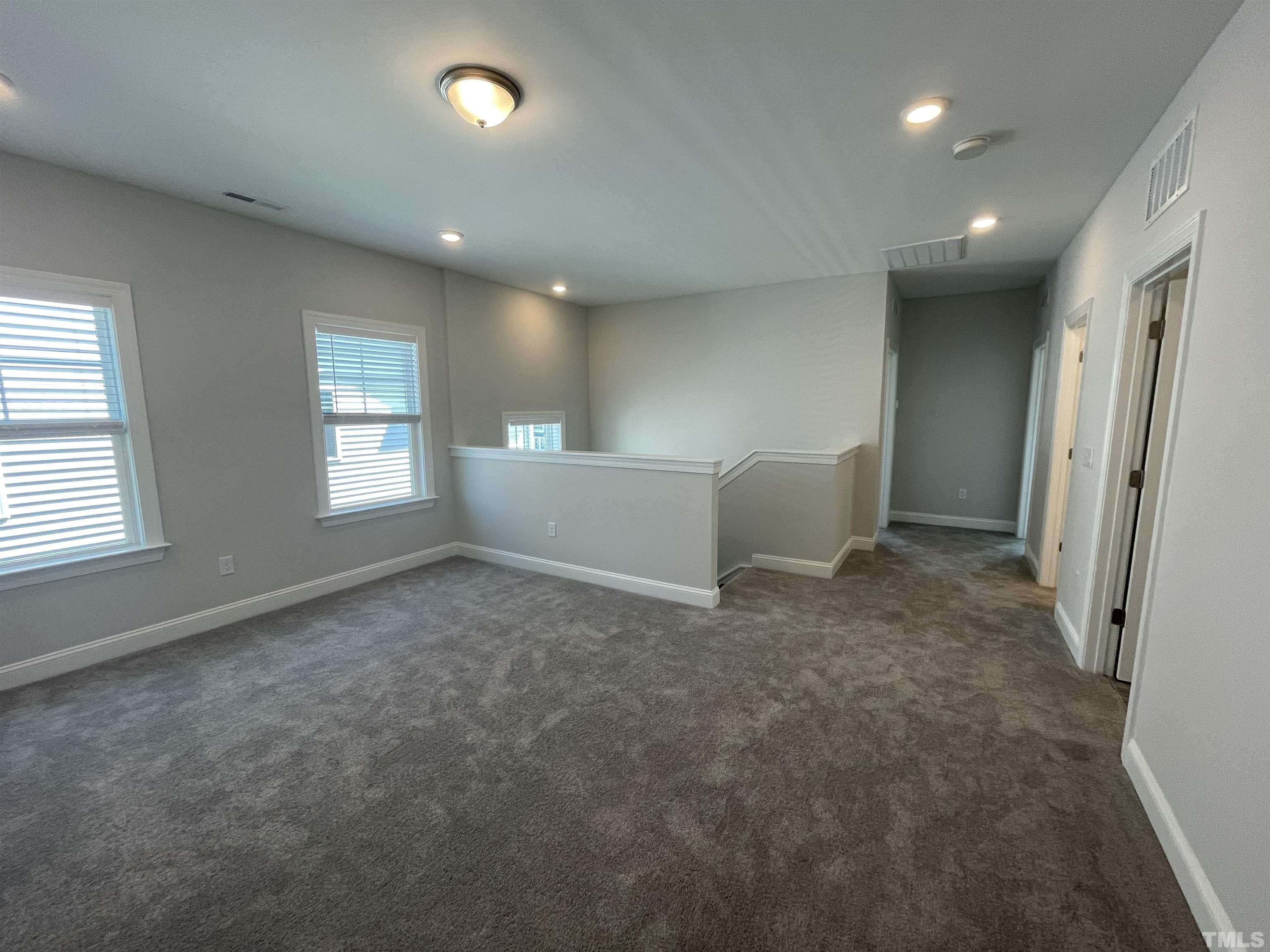 167 Edge Of Auburn Boulevard Clayton, NC 27520 - Photo 14 of 27 a view of an empty room with a window