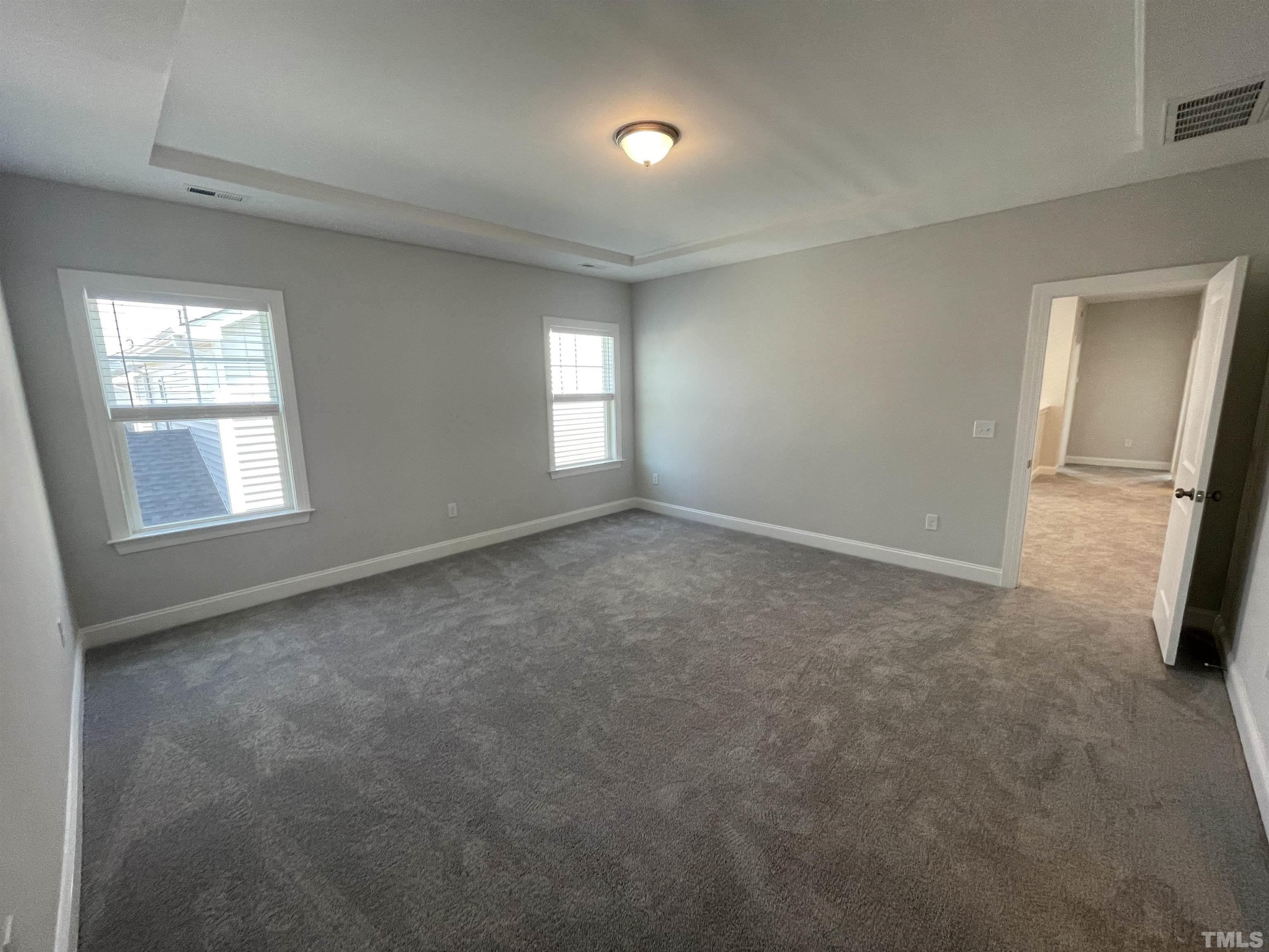 167 Edge Of Auburn Boulevard Clayton, NC 27520 - Photo 16 of 27 an empty room with windows and entrance