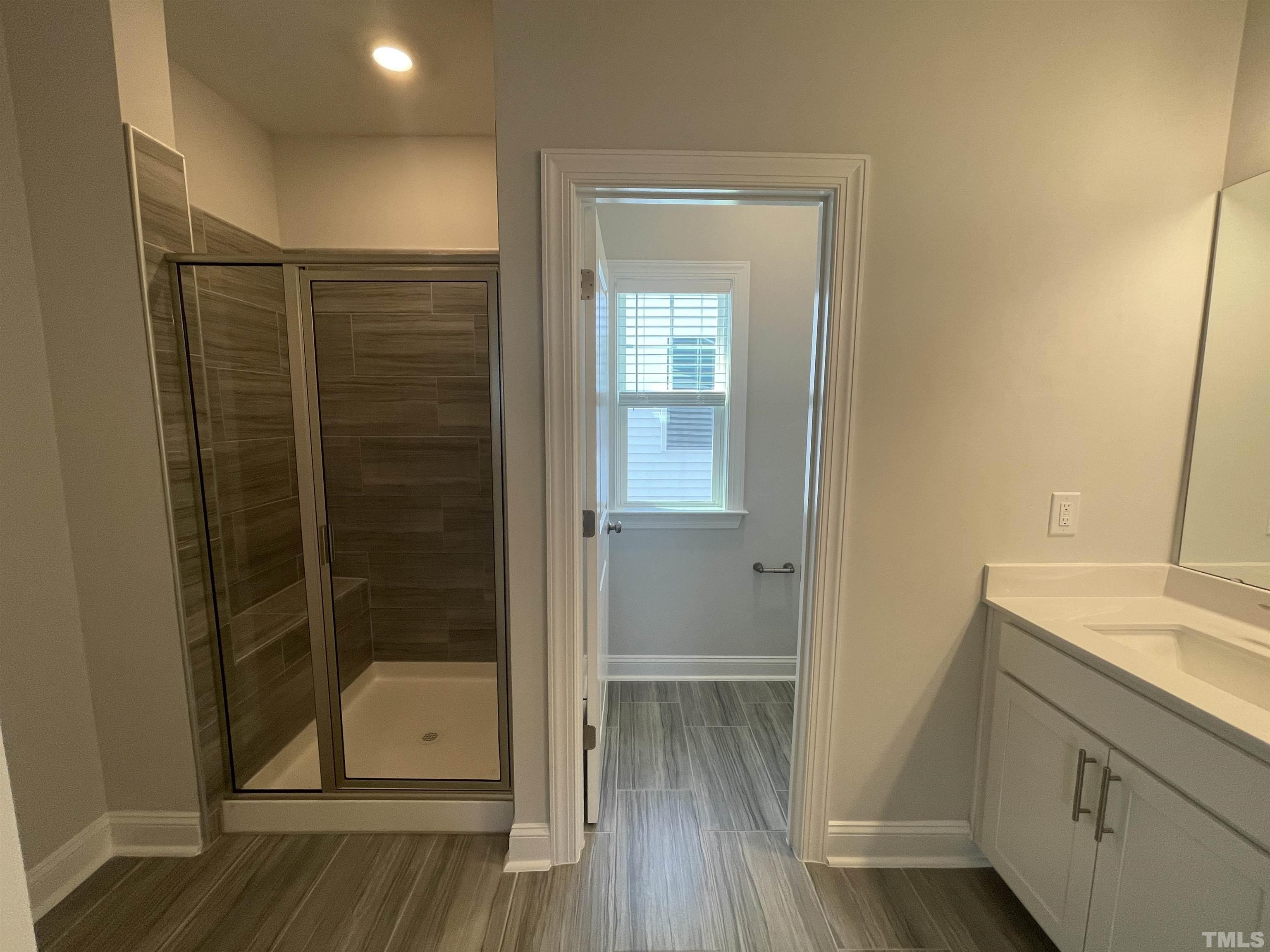 167 Edge Of Auburn Boulevard Clayton, NC 27520 - Photo 18 of 27 a bathroom with a shower and a sink