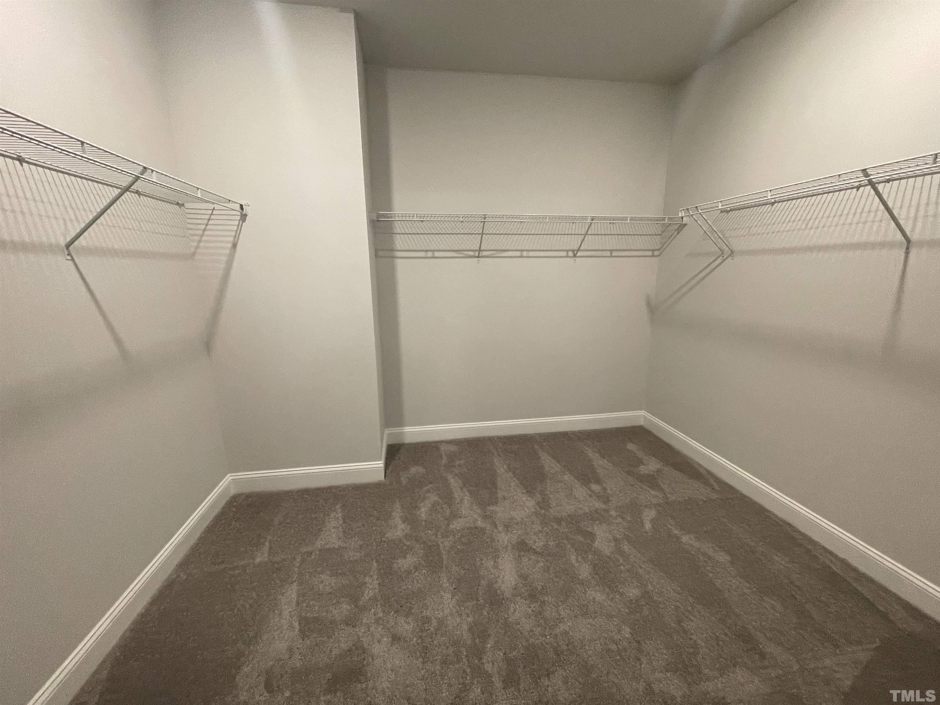 167 Edge Of Auburn Boulevard Clayton, NC 27520 - Photo 19 of 27 a view of a room with racks on the wall