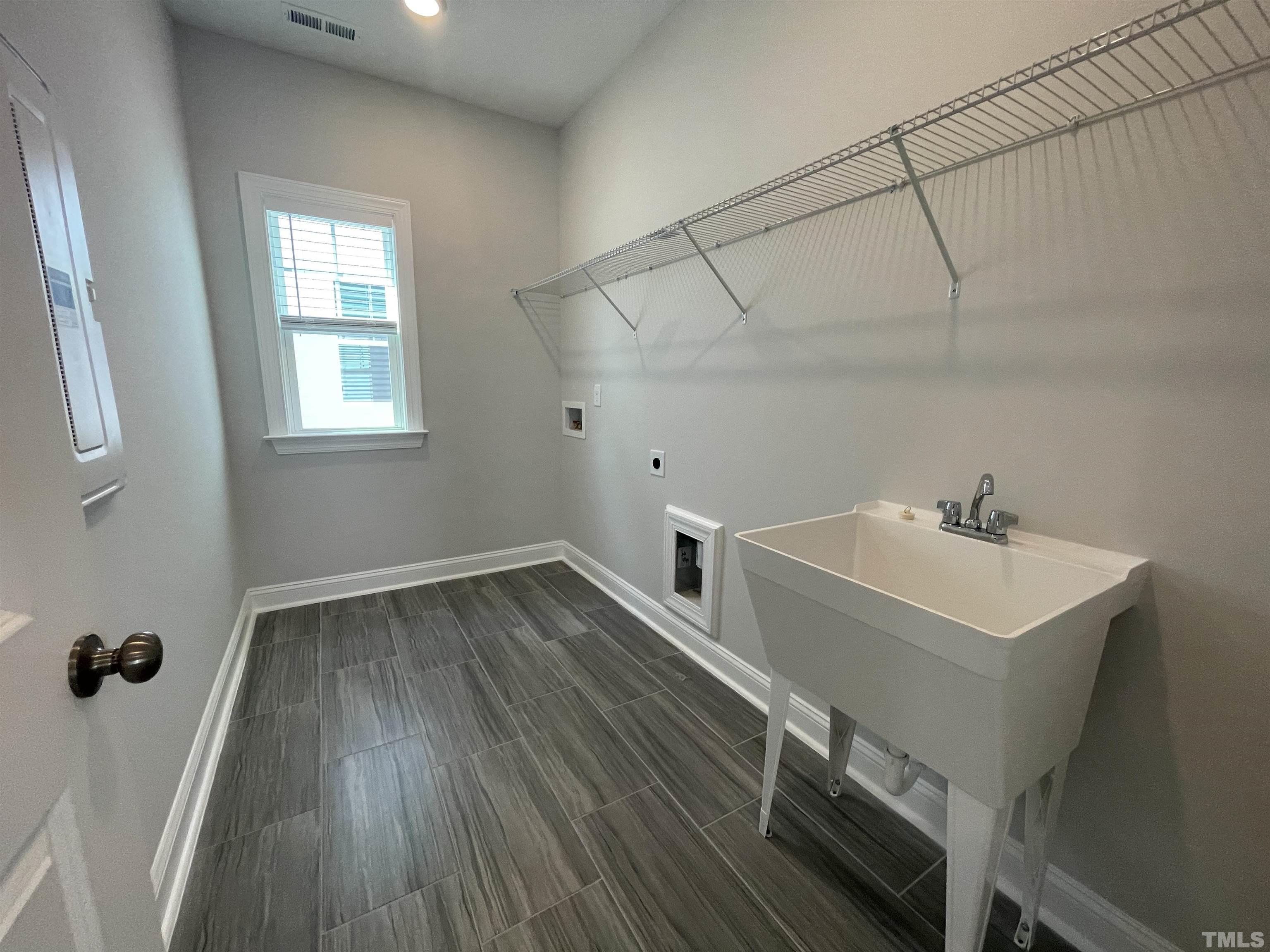 167 Edge Of Auburn Boulevard Clayton, NC 27520 - Photo 25 of 27 a view of a room with wooden floors and sink