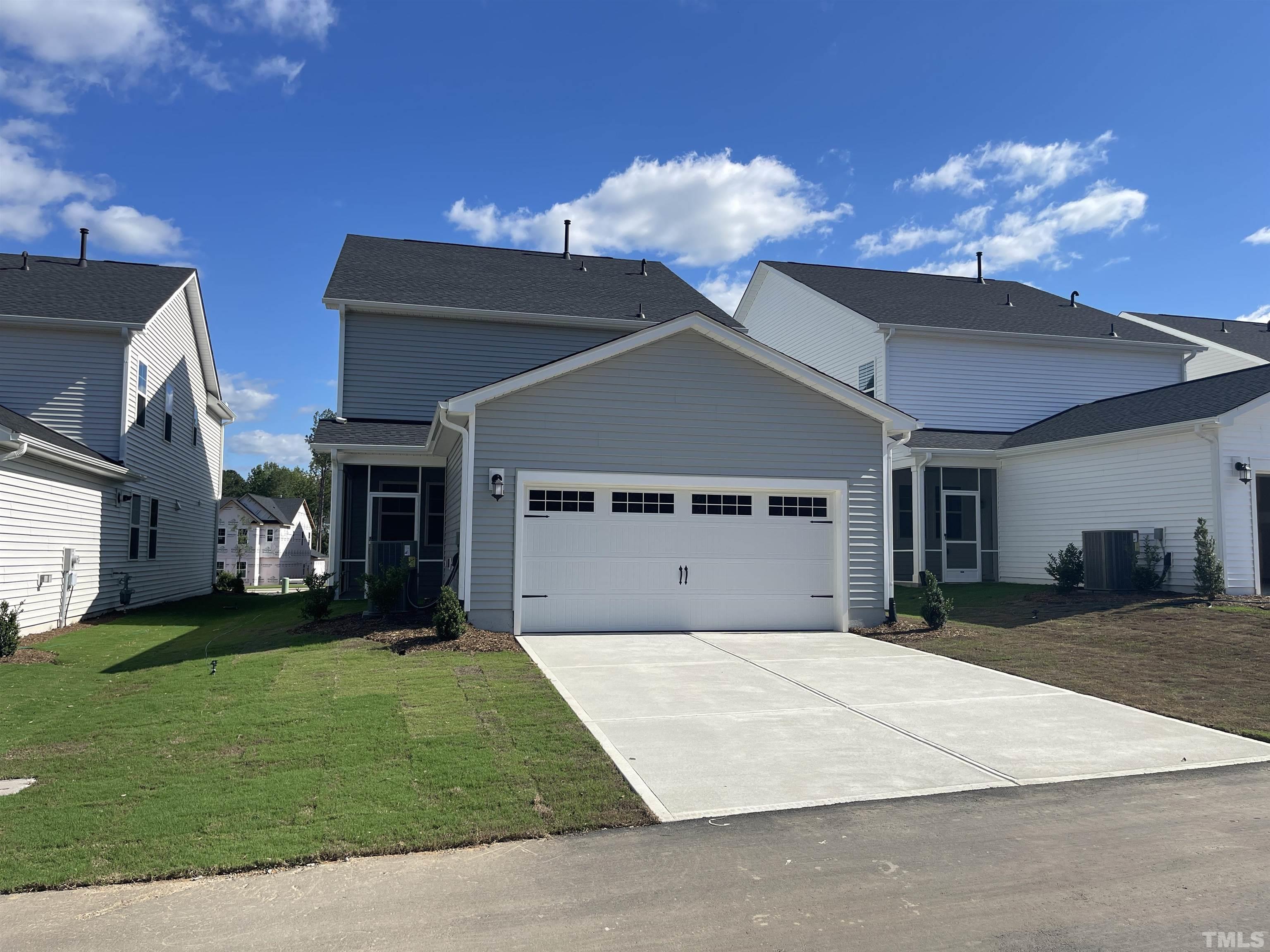 167 Edge Of Auburn Boulevard Clayton, NC 27520 - Photo 27 of 27 a front view of a house with a yard and garage