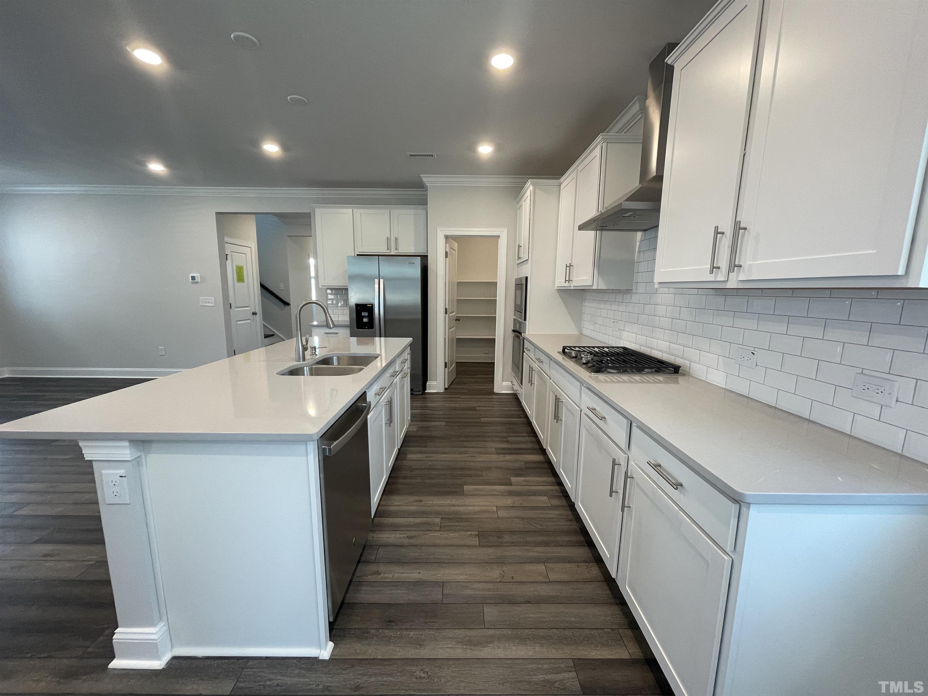 167 Edge Of Auburn Boulevard Clayton, NC 27520 - Photo 8 of 27 a large kitchen with a stove and a sink