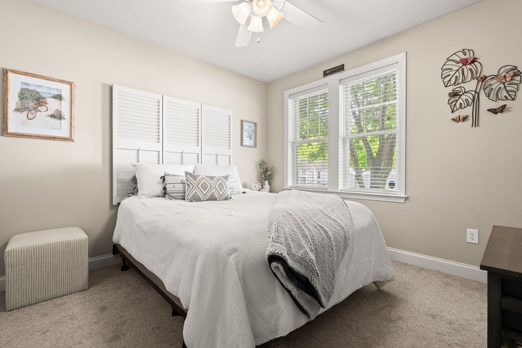 10 Malta Street, Unit 1 Hull, MA 02045 - Photo 11 of 17 a bed room with a bed and a chair