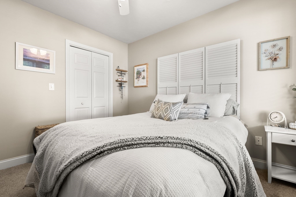 10 Malta Street, Unit 1 Hull, MA 02045 - Photo 12 of 17 a bedroom with a bed and a couch