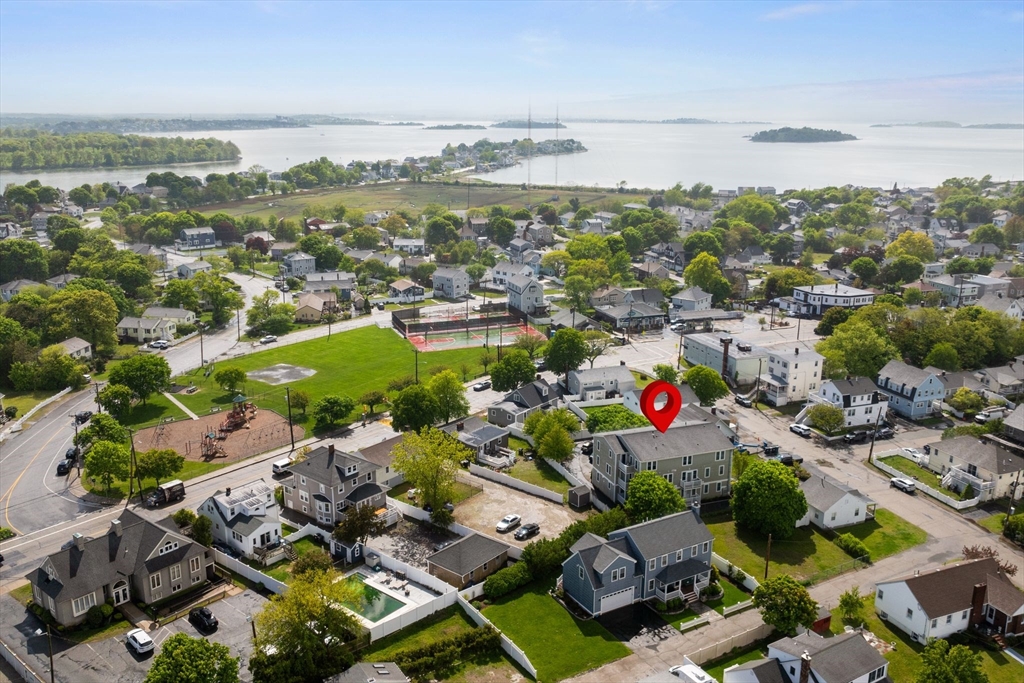 10 Malta Street, Unit 1 Hull, MA 02045 - Photo 4 of 17 an aerial view of a houses with a lake view