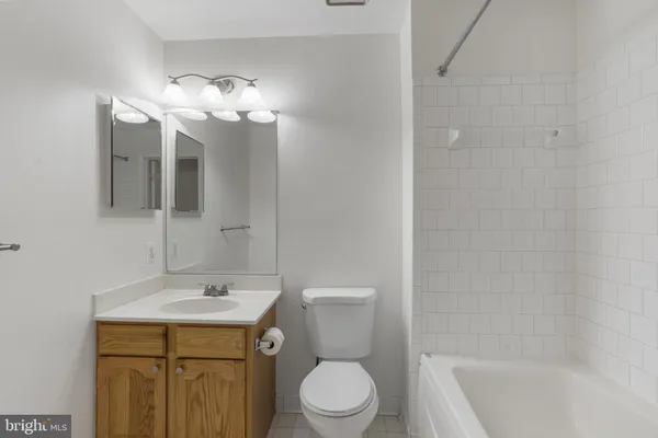 a bathroom with a sink a toilet and a bathtub