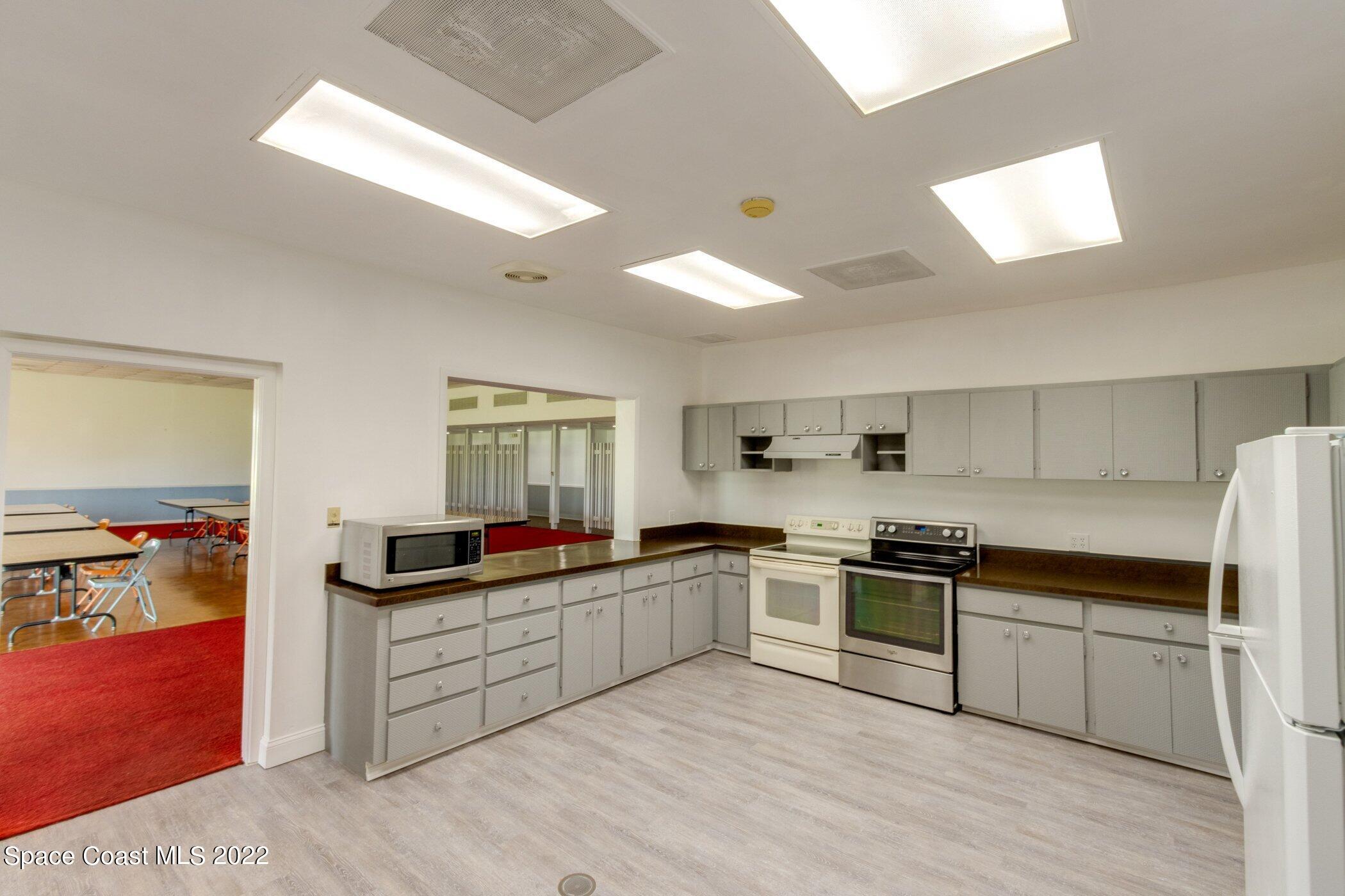2727 North Wickham Road, Unit 10104 Melbourne, FL 32935 - Photo 41 of 52 Clubhouse Kitchen