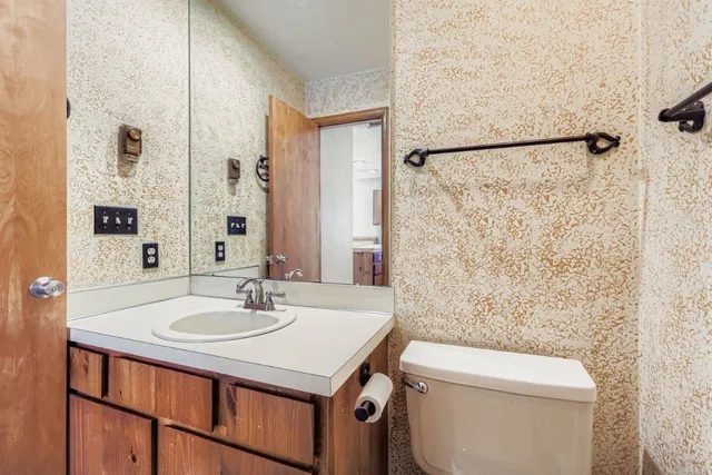 a bathroom with a glass shower door
