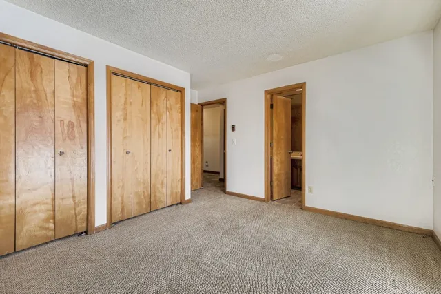 a bathroom with a sink a toilet and shower curtain