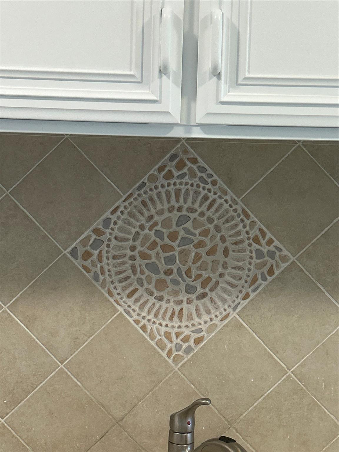 175 Southeast St Lucie Boulevard, Unit E134 Stuart, FL 34996 - Photo 17 of 30 Custom backsplash over kitchen sinks.