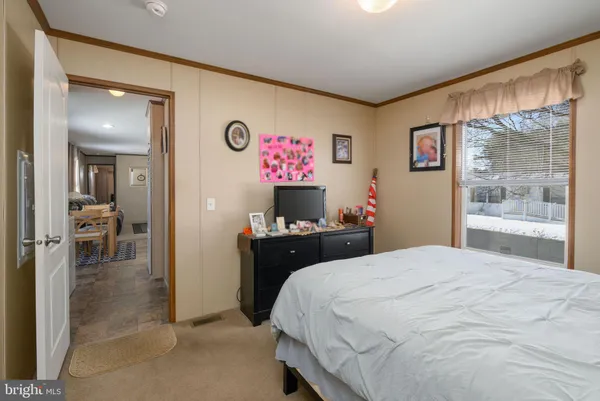 a bedroom with a bed and a cabinets