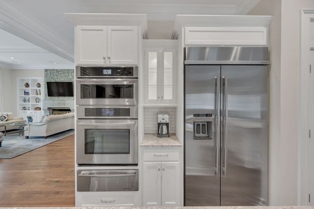 a view of kitchen with wooden floor and window