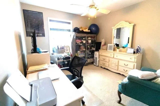 a living room with furniture and a flat tv screen or dressers