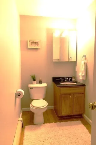 a bathroom with a toilet and a sink