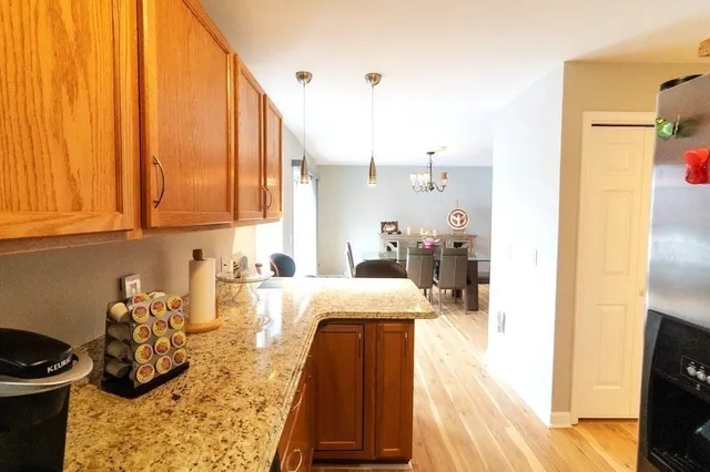 a kitchen with sink refrigerator and stove