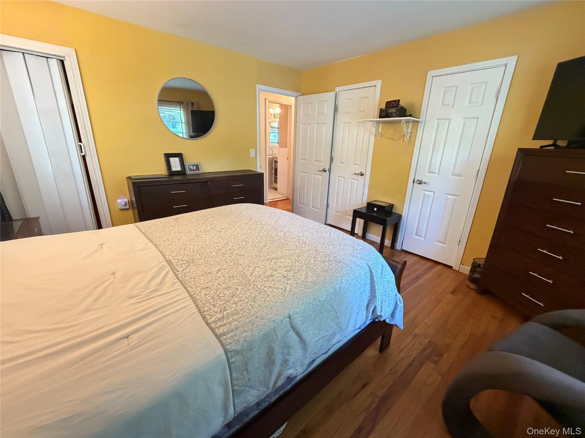 17 Mallory Road Spring Valley, NY 10977 - Photo 18 of 26 a bed sitting in a bedroom and a mirror