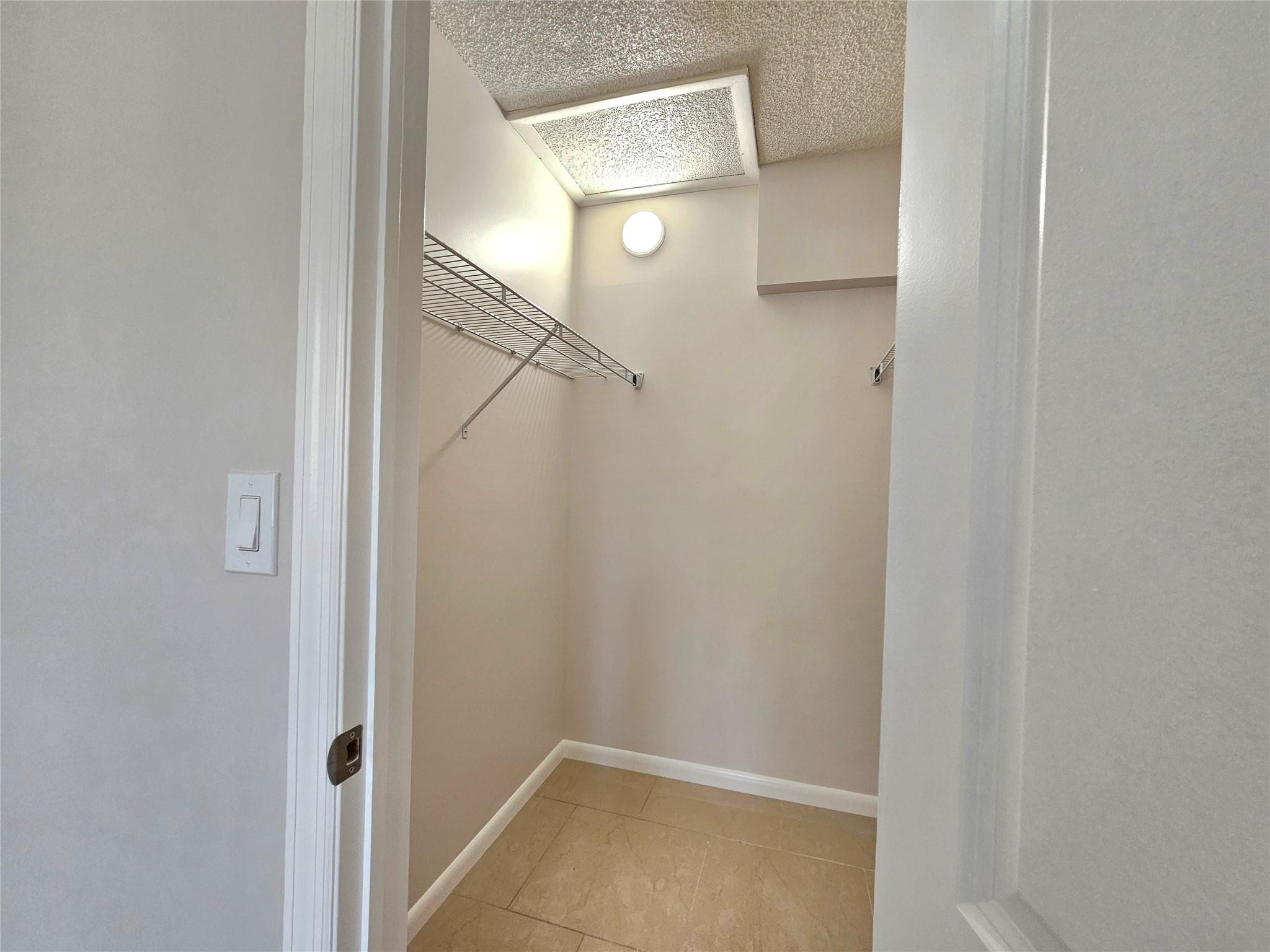 631 Lyons Road, Unit 12207 Pompano Beach, FL 33063 - Photo 18 of 30 WALK-IN CLOSET