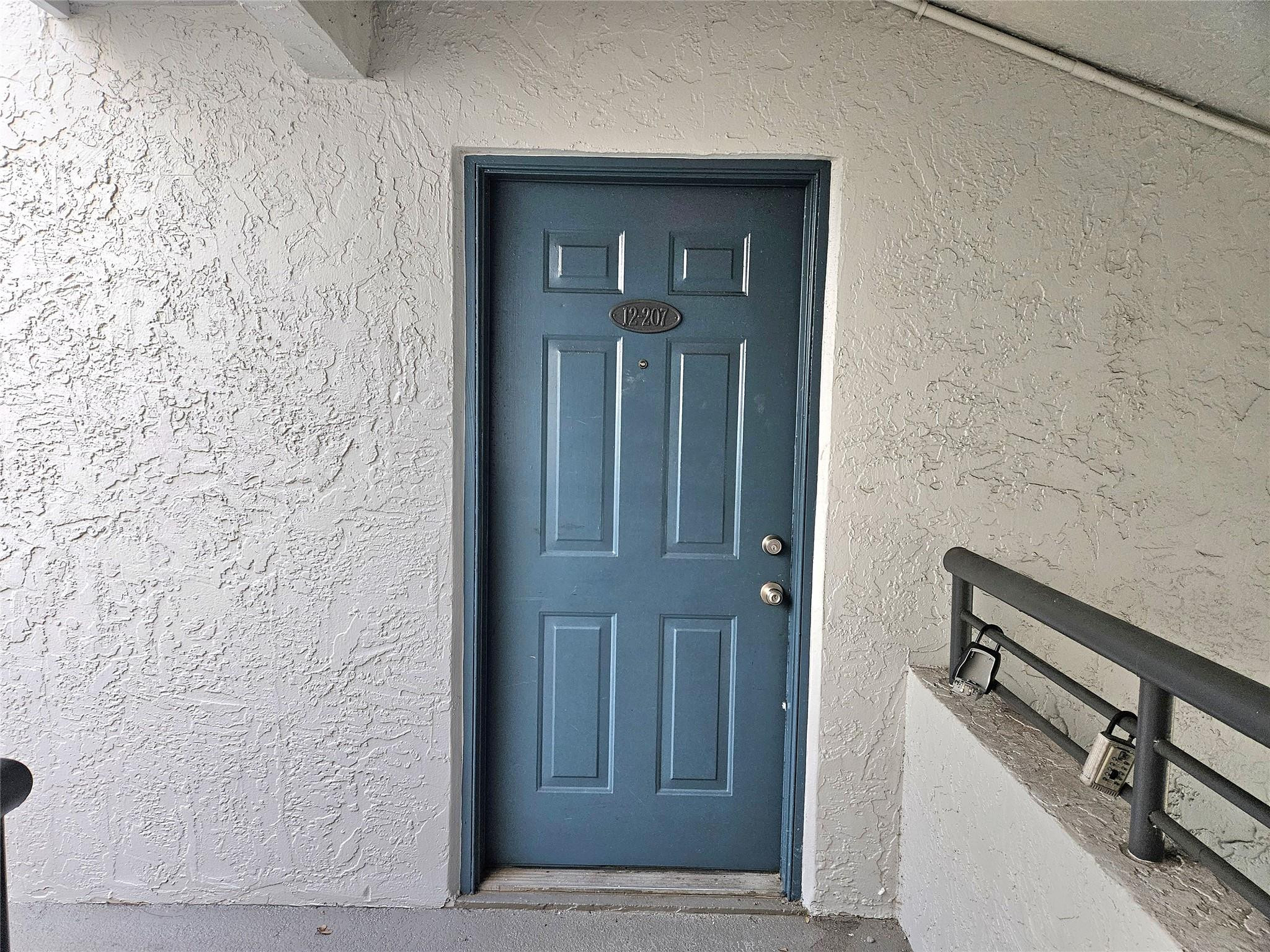 631 Lyons Road, Unit 12207 Pompano Beach, FL 33063 - Photo 4 of 30 ENTRANCE DOOR