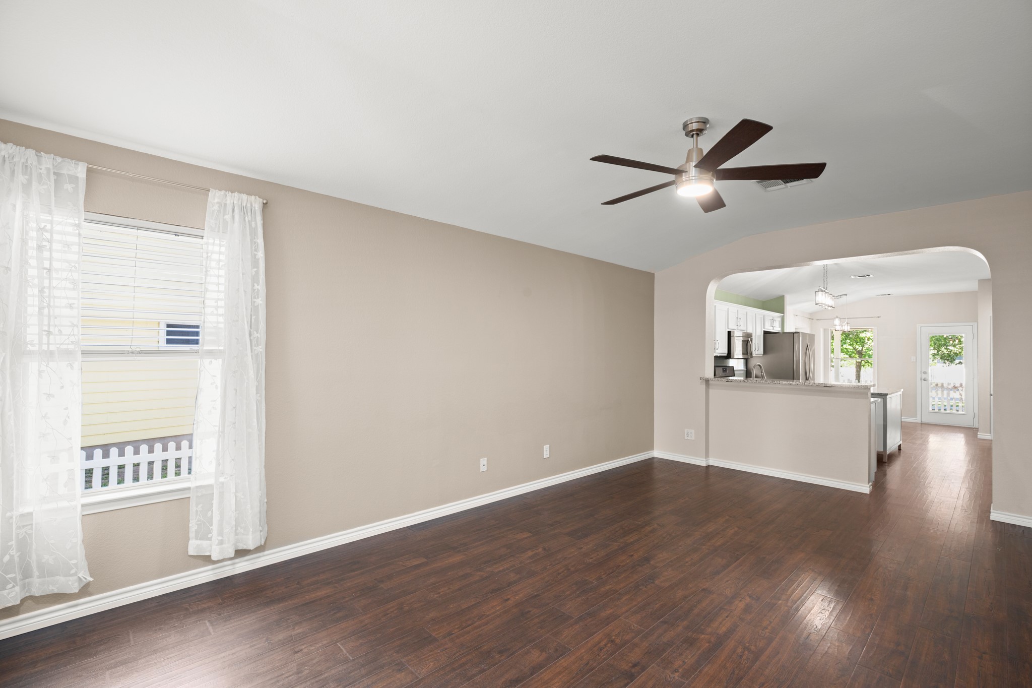 151 Sampson Kyle, TX 78640 - Photo 15 of 23 Curved archways introduce subtle architectural detail that softens the open layout beautifully.