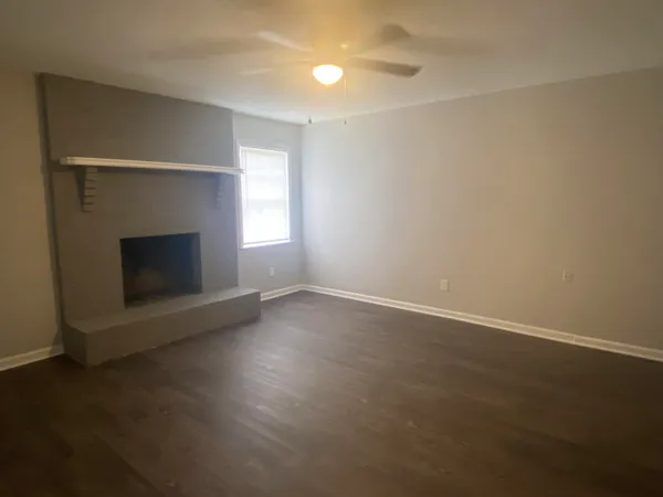 an empty room with a fireplace