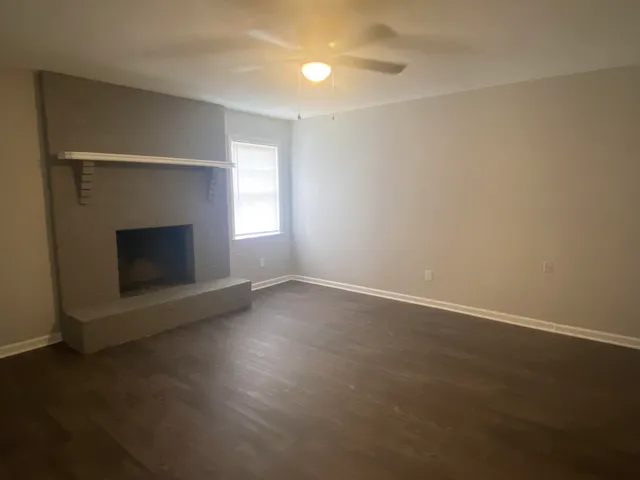 an empty room with a fireplace