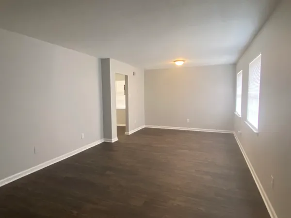 a view of an empty room with a window