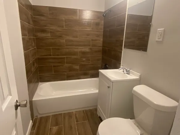 a bathroom with a toilet and a bathtub