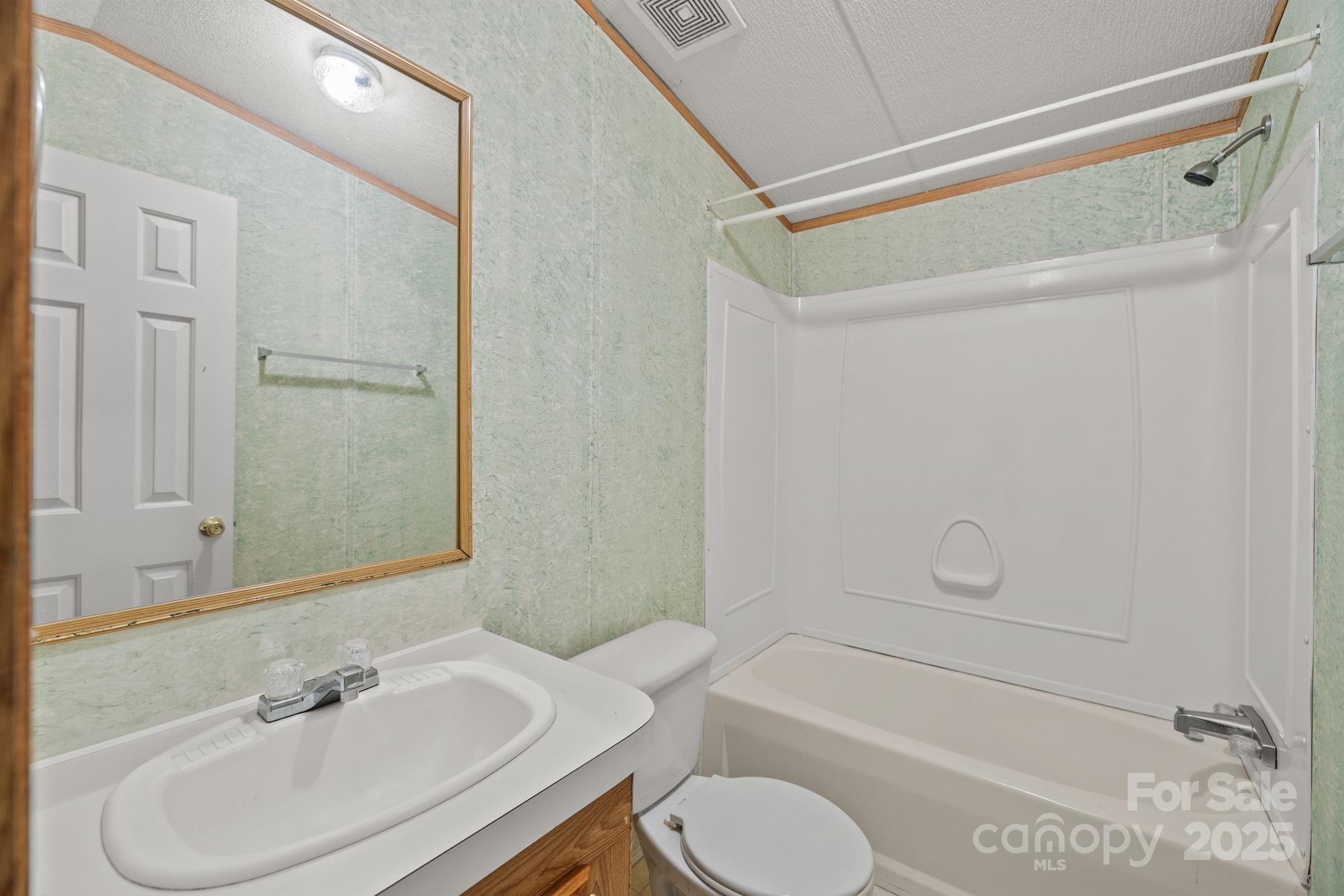 2909 New Town Road Monroe, NC 28110 - Photo 18 of 31 a bathroom with a sink toilet and shower